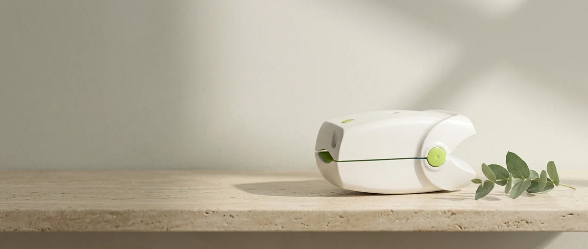The nail care device on a warm stone surface